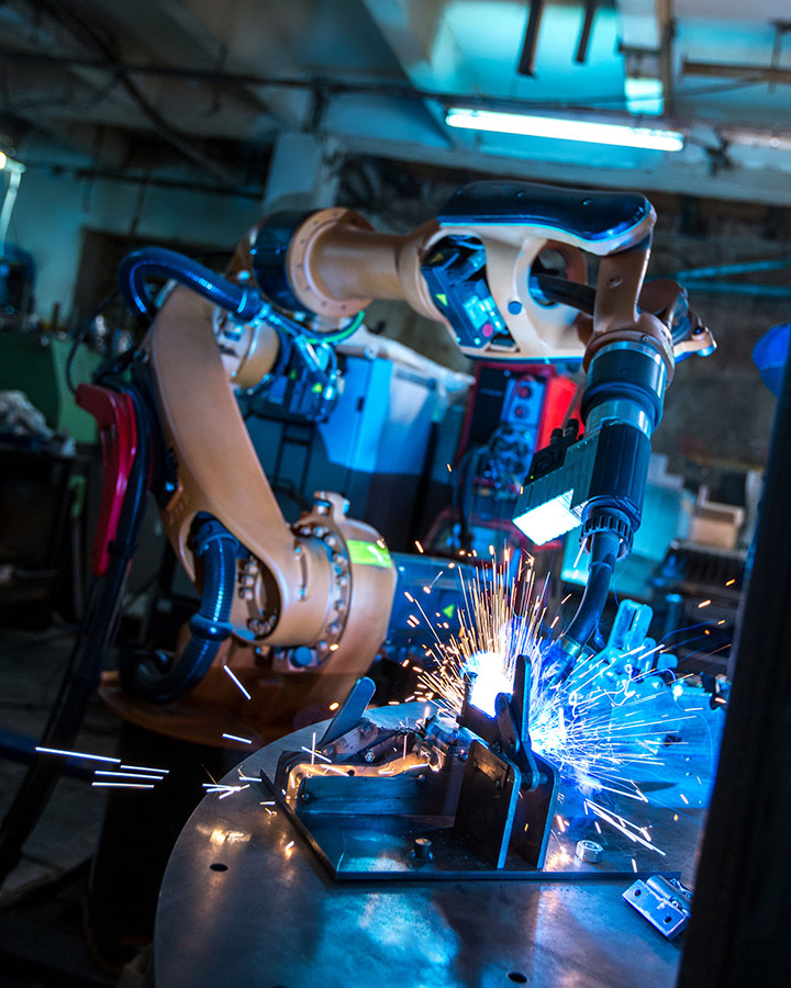 45591136 - manufacturing. image of robotic machine welding metal fasteners